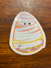A mummy-wrapped candy corn sticker. 