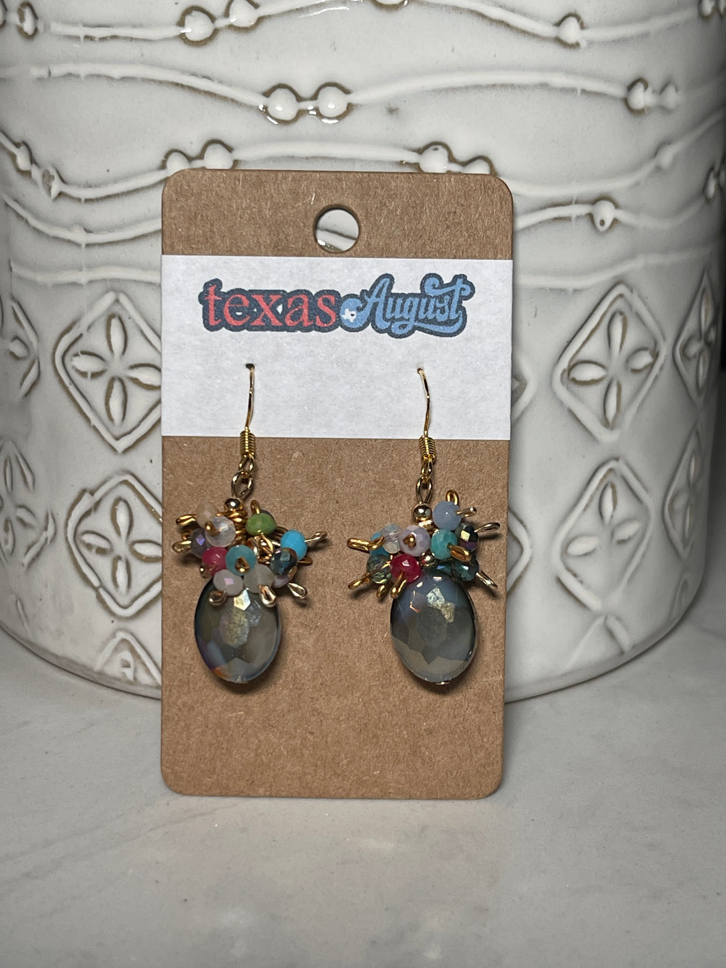 These gorgeous earrings are part of the Texas Wildflower Collection. Dress them up or down, the floating faceted glass beads move with you throughout the day and the faceted slate grey anchors everything together.  These are so much fun ti wear! Almost every color you could ask for all wrapped up in one pair of earrings.   *Each set is a one-of-a-kind piece!