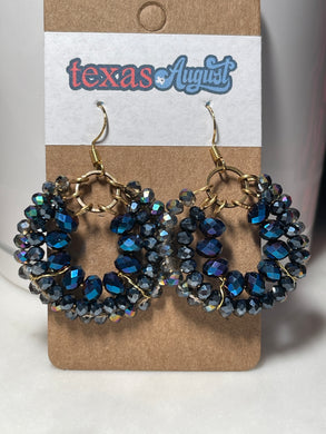 These Blue Hues are so dynamic and vibrant! Great for a day of meetings, even better for Rodeo or 4th of July!  Faceted glass beads and wire-wrapped hoops in Royal, Navy and iridescent cool Blue.   *Each set is a one-of-a-kind piece!