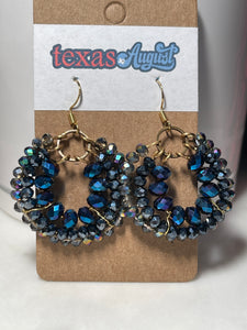 These Blue Hues are so dynamic and vibrant! Great for a day of meetings, even better for Rodeo or 4th of July!  Faceted glass beads and wire-wrapped hoops in Royal, Navy and iridescent cool Blue.&nbsp;  *Each set is a one-of-a-kind piece!