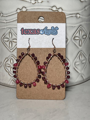 These earrings were inspired by the reds, cranberries and pinks that the prickly pear displays. These red and pink garnet beads are hand wrapped in a teardrop shape with gold accents.