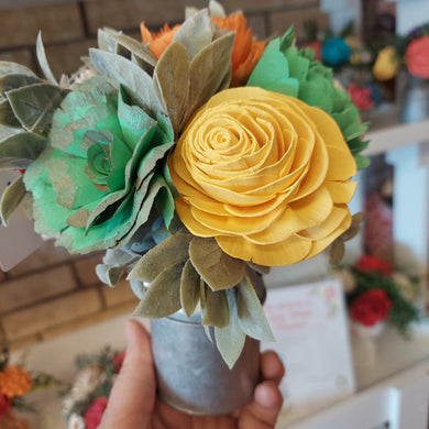 Sola wood flowers in small metal milk jug