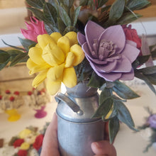 Sola wood flowers in small metal milk jug